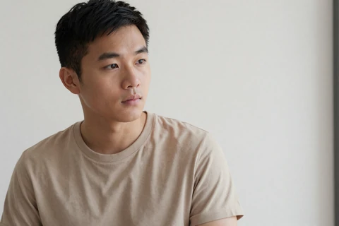 Jordan, 29-year-old member of the inclusive dating app, in a minimalist white studio portrait
